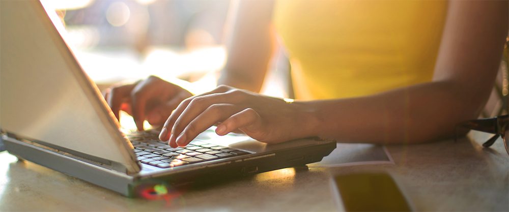 Woman typing on laptop