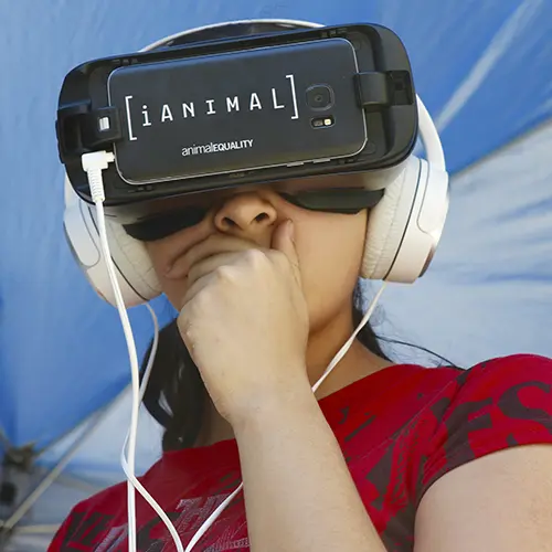 Woman using iAnimal virtual reality headset
