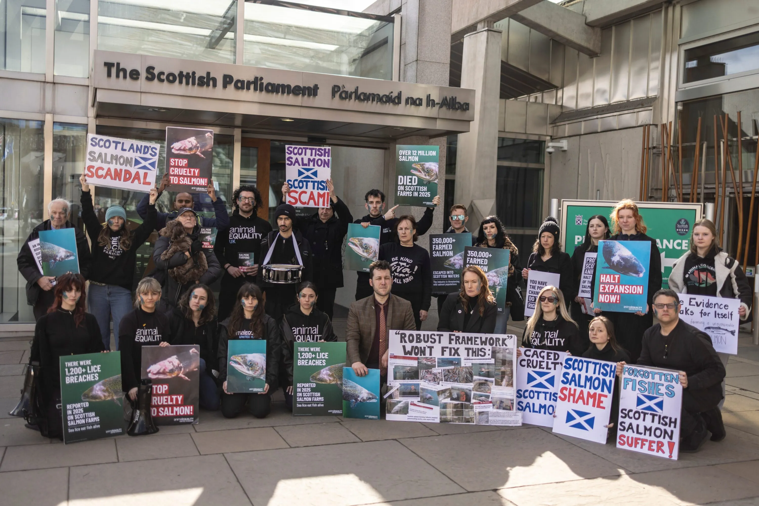Activists at protest against salmon farming in front of The Scottish parliament