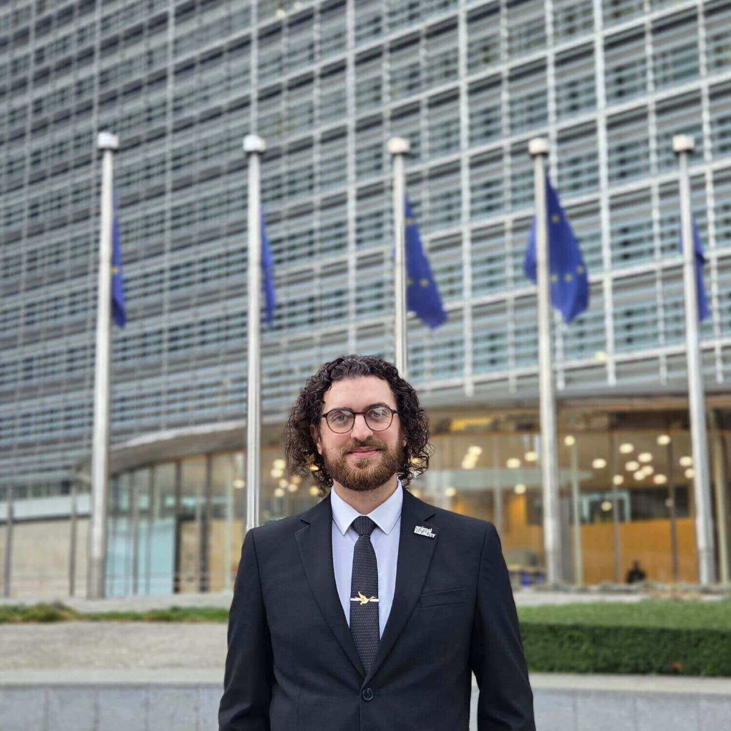 Animal Equality UK team member in front of Brussels EU Parliament